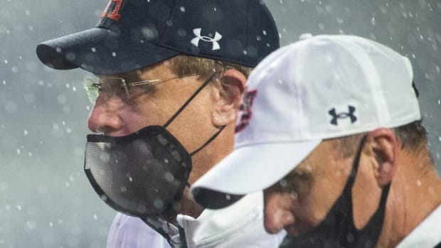 Auburn coach Gus Malzahn and offensive coordinator Chad Morris walk off the field at Jordan Hare Stadium in Auburn, Ala., on Saturday, Oct. 10, 2020. Auburn defeated Arkansas 30-28. 